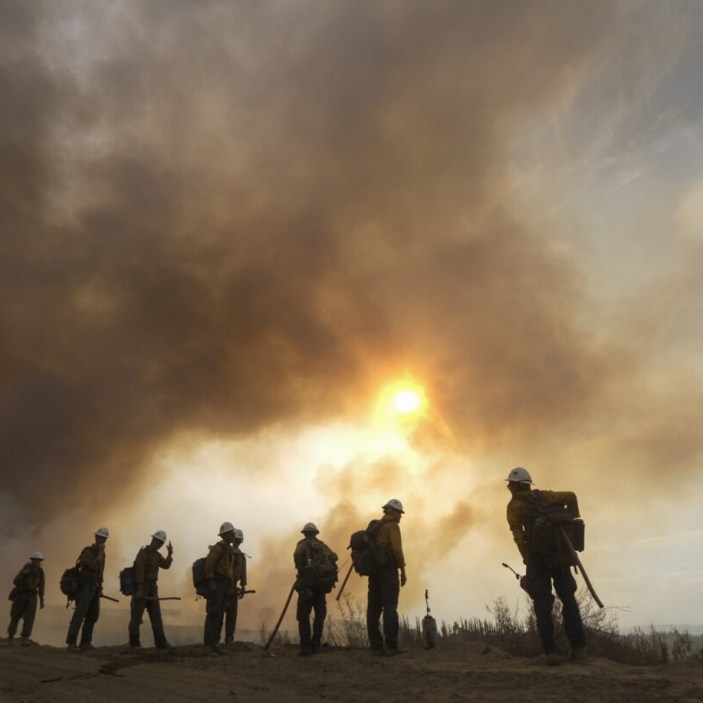 Extreme heat, wildfire smoke harm low-income and nonwhite communities the most, study finds | AP News