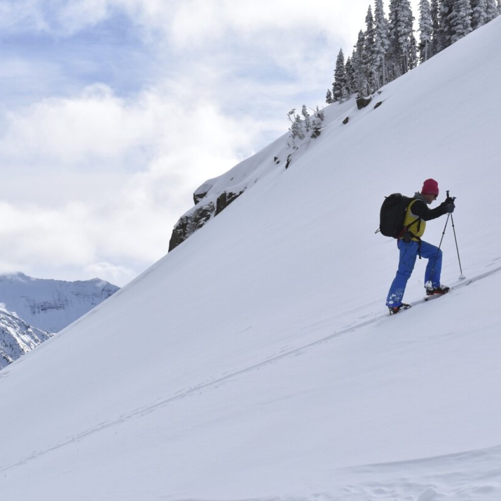 Avalanche forecasters try to curb deaths as skiers and snowmobilers flock to backcountry areas | AP News