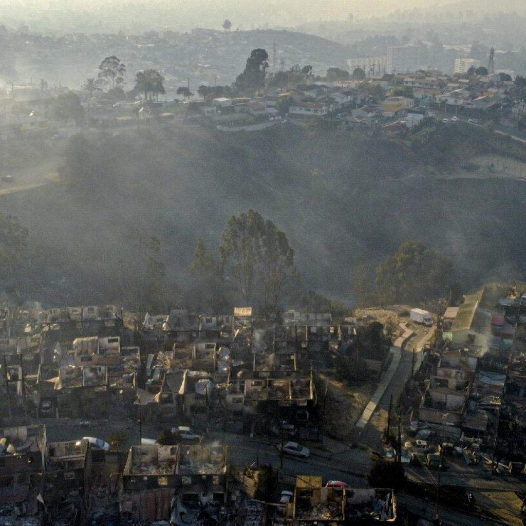 At least 19 dead as forest fires approach densely populated areas of central Chile | AP News