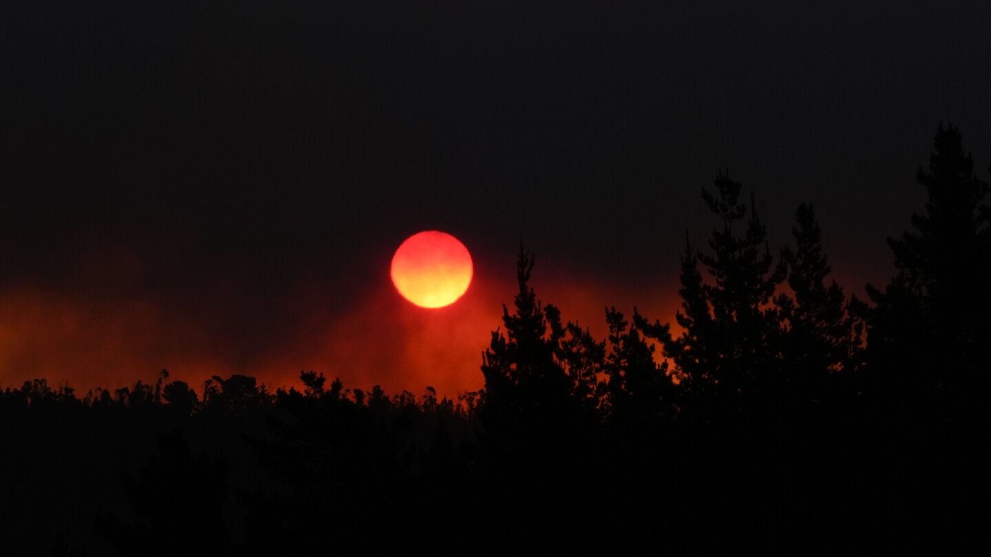 Forest fires rage on in central Chile killing at least 64 | AP News