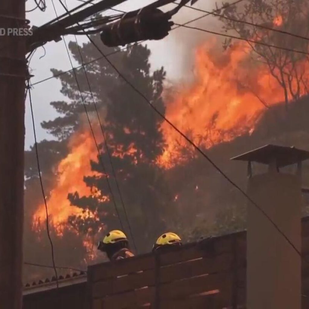 Dozens reported dead in Chile as forest fires move into densely populated central areas | AP News