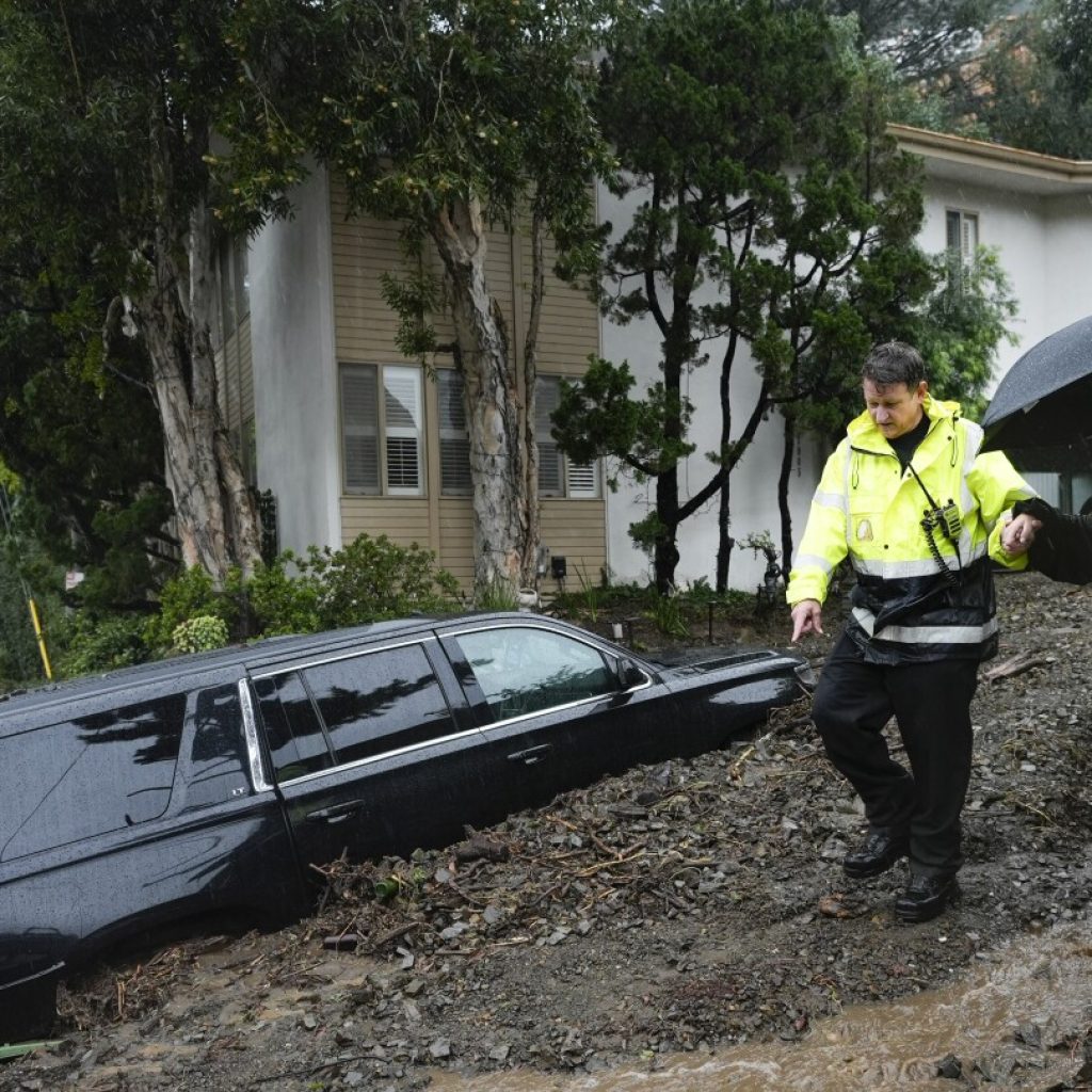 Less rain forecast but historic Southern California storm still threatens flooding and landslides | AP News