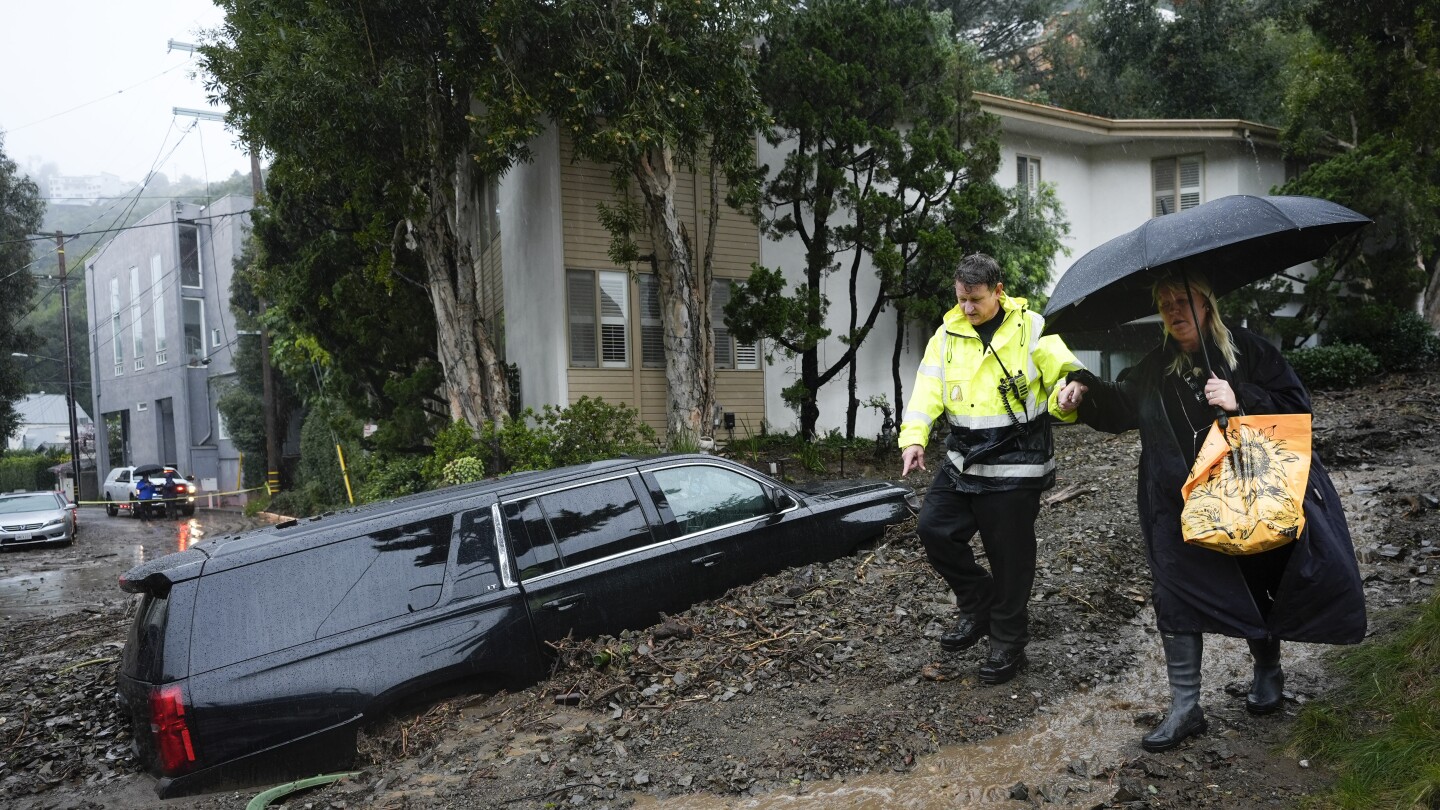 Less rain forecast but historic Southern California storm still threatens flooding and landslides | AP News