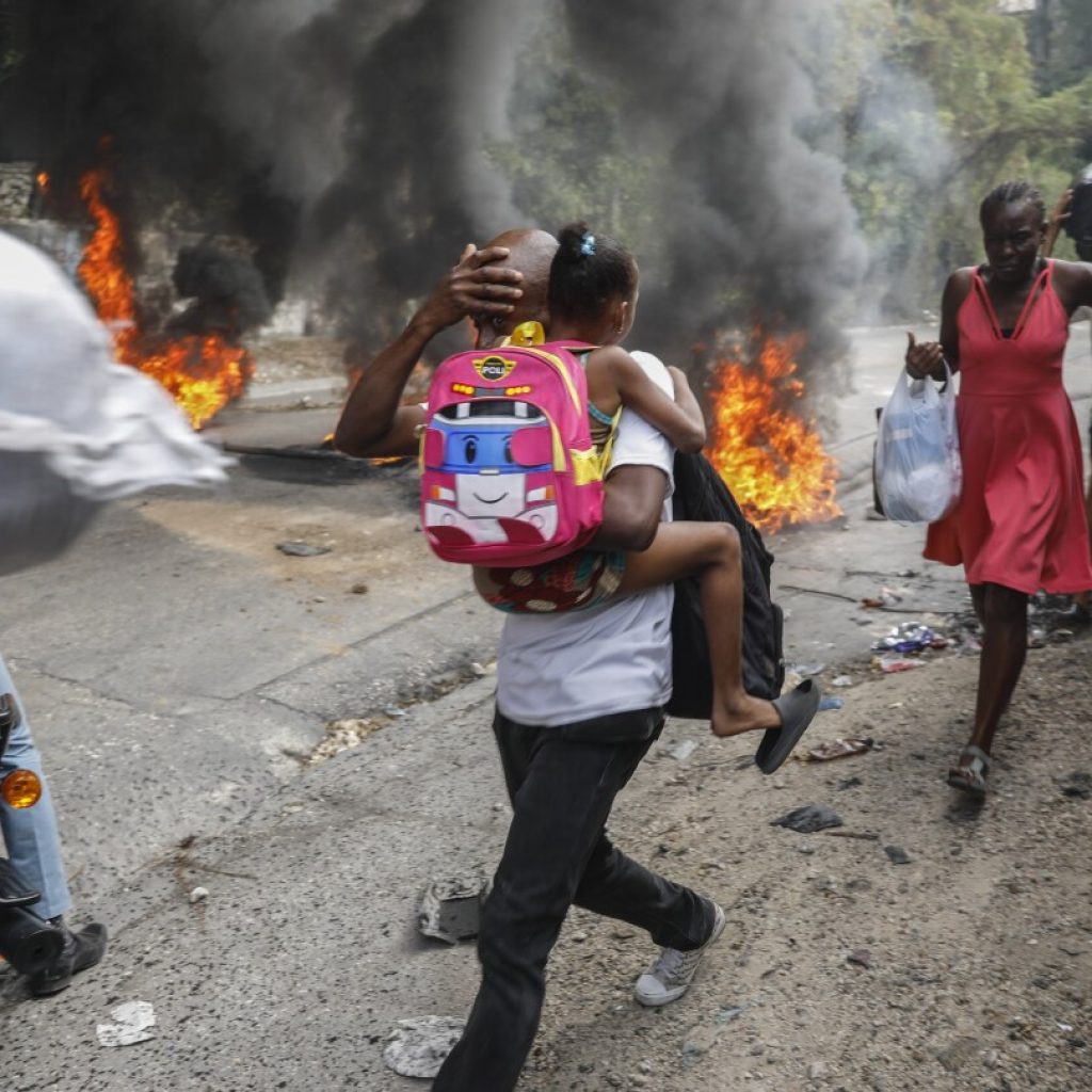 Former rebel leader arrives in Haiti’s capital as protests against prime minister gain momentum