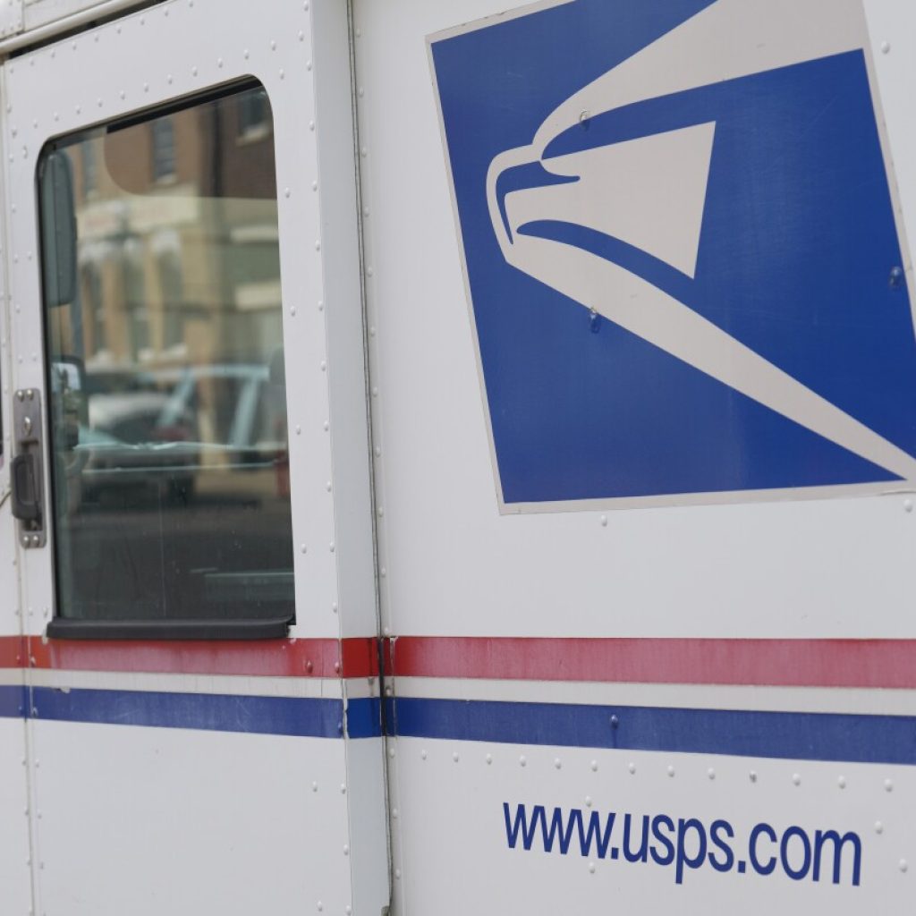 Postal Service, once chided for slow adoption of EVs, announces plan to cut greenhouse gas emissions