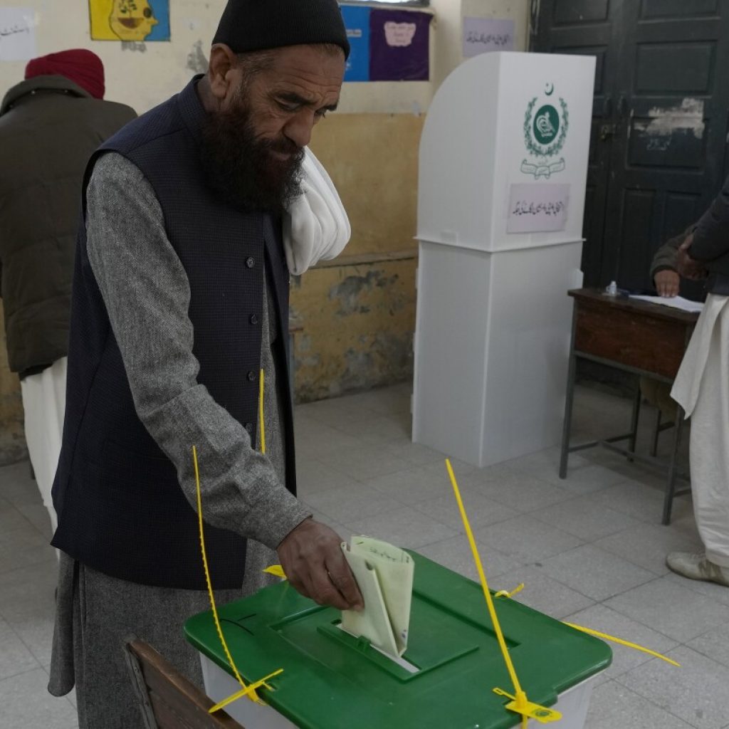 Pakistan votes for a new parliament as militant attacks surge and jailed leader’s party cries foul