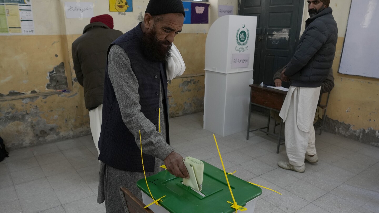 Pakistan votes for a new parliament as militant attacks surge and jailed leader’s party cries foul