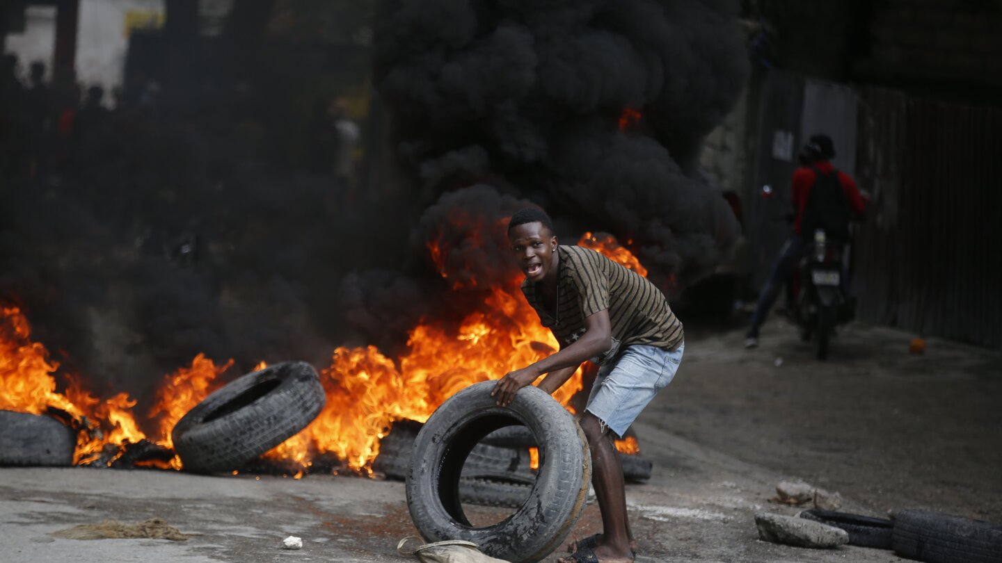 Haiti’s prime minister urges calm as violent protests seek his ouster