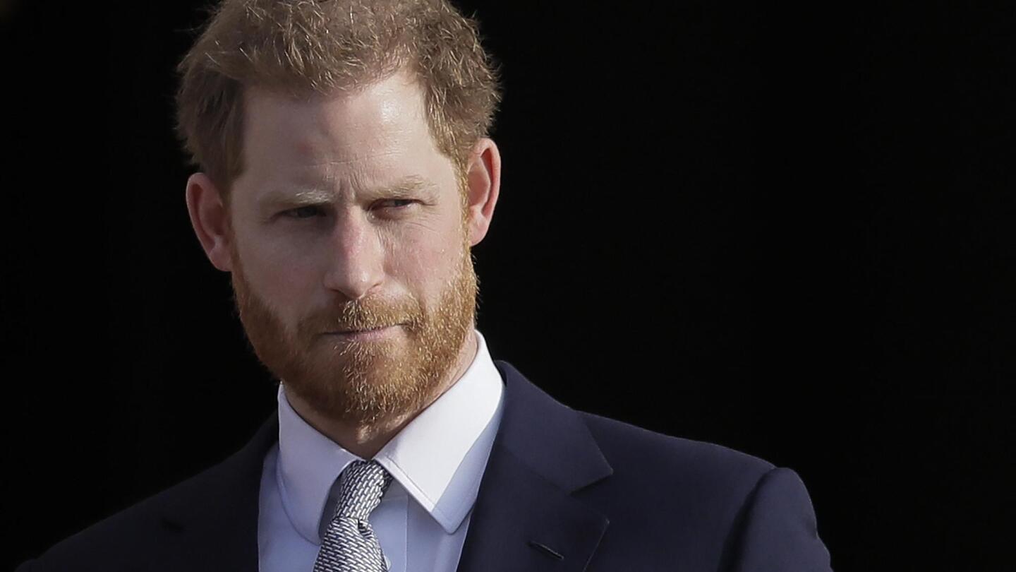 Prince Harry settles a tabloid phone hacking claim and says his mission to tame the media continues