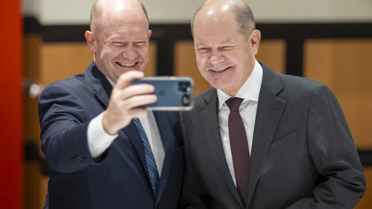 US Sen. Coons and German Chancellor Scholz see double at Washington meeting