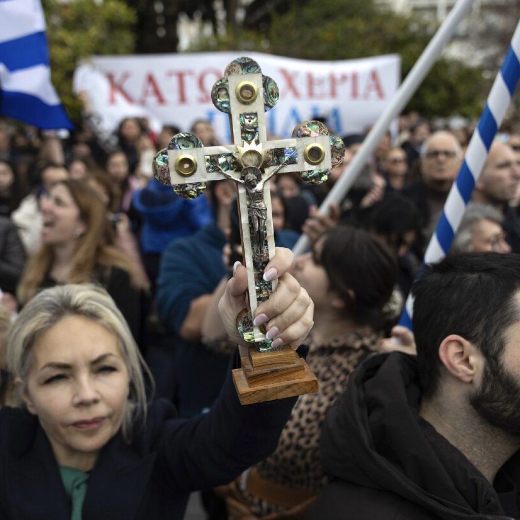 Hundreds of protesters opposed to bill allowing same-sex marriage rally in Greek capital