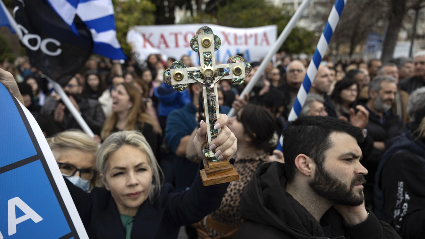 Hundreds of protesters opposed to bill allowing same-sex marriage rally in Greek capital