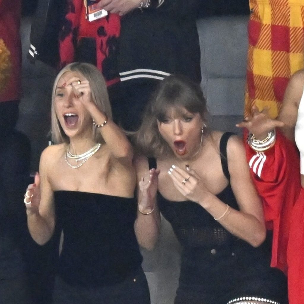 Taylor Swift cheering at Super Bowl as she watches Travis Kelce and the Chiefs play the 49ers