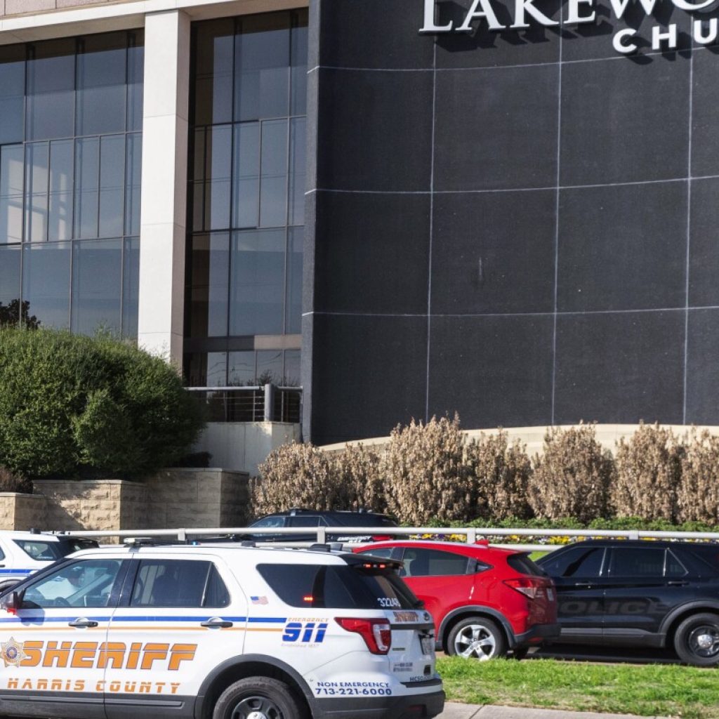 Shooter entered Texas megachurch with young son and used AR-style rifle in the attack, police say