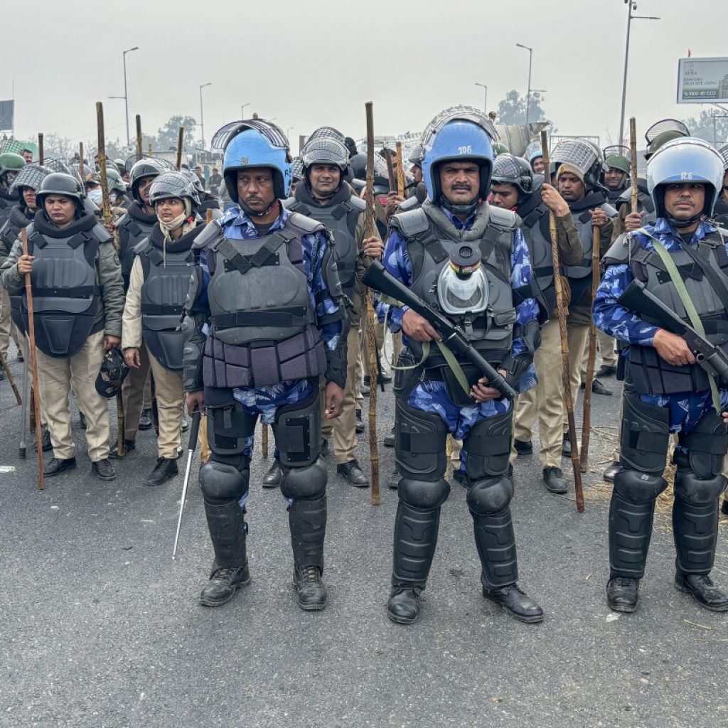 Police use tear gas against Indian farmers marching to New Delhi to demand guaranteed crop prices