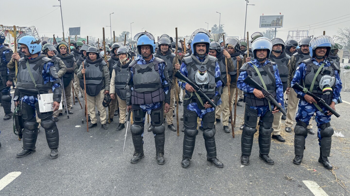 Police use tear gas against Indian farmers marching to New Delhi to demand guaranteed crop prices