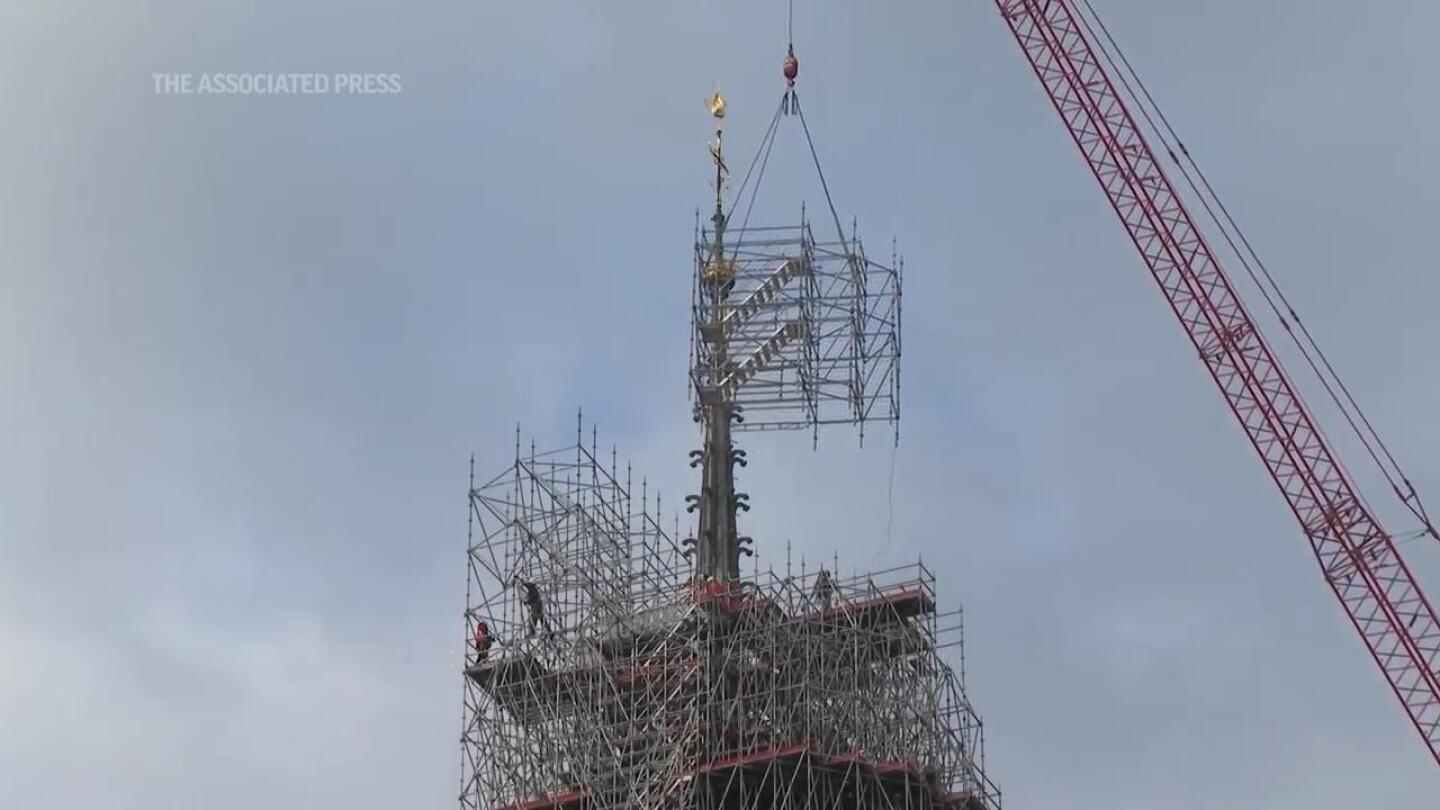 Removal of scaffolding enshrouding the summit of Paris’ Notre Dame Cathedral gets underway | AP News