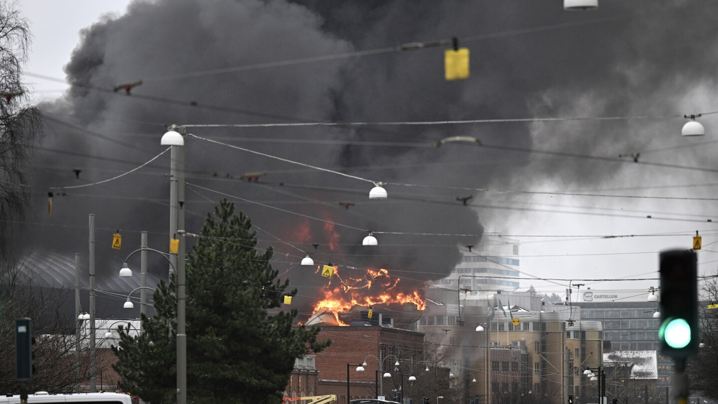 1 person missing as firefighters in Sweden struggle for second day to put out a water park fire