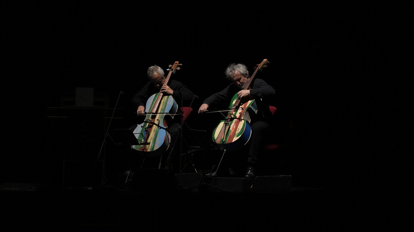 La Scala concert features violins that inmates made from battered migrant boats