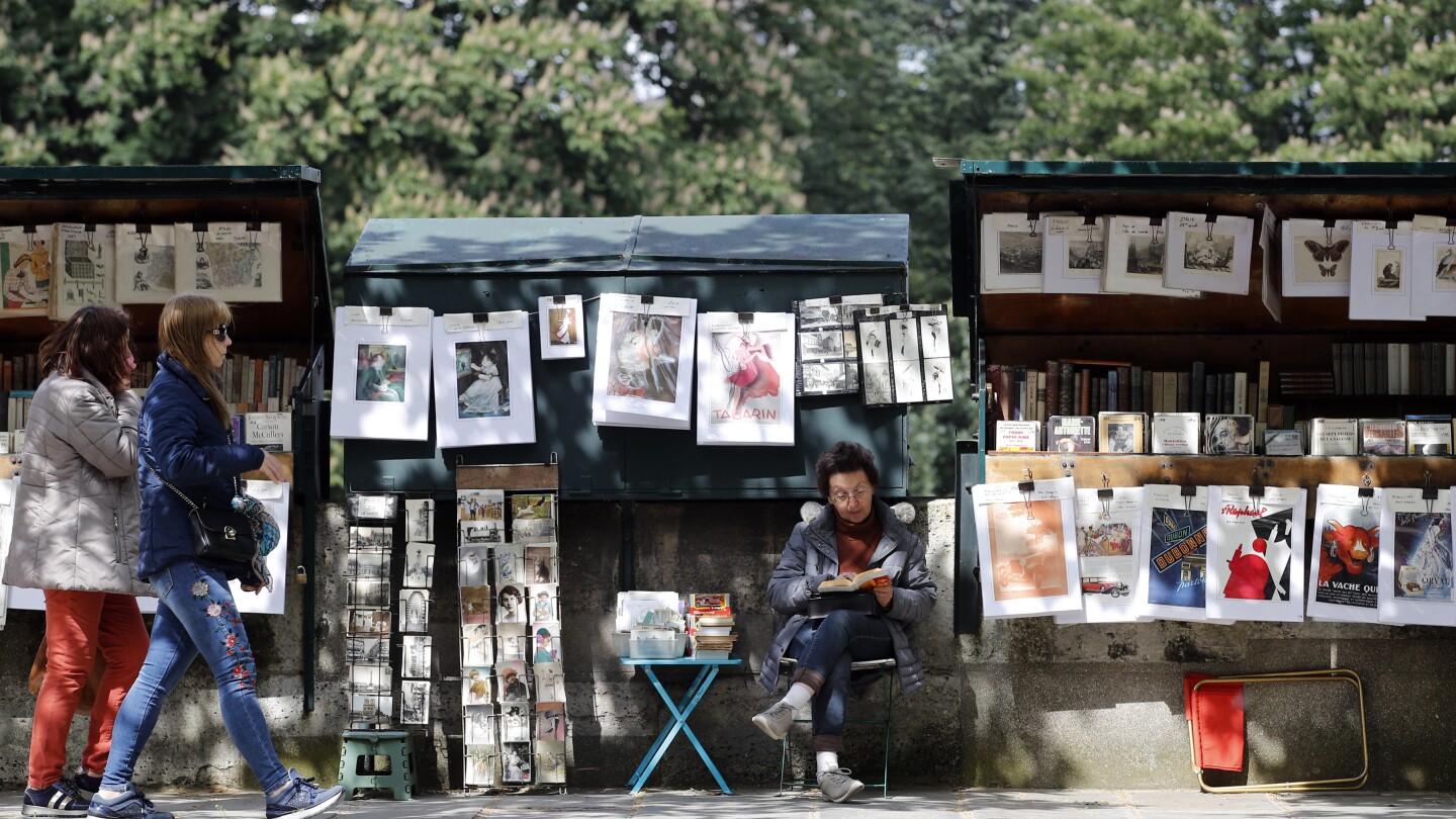 President’s intervention keeps Paris’ riverside bookstalls in place for the Olympics