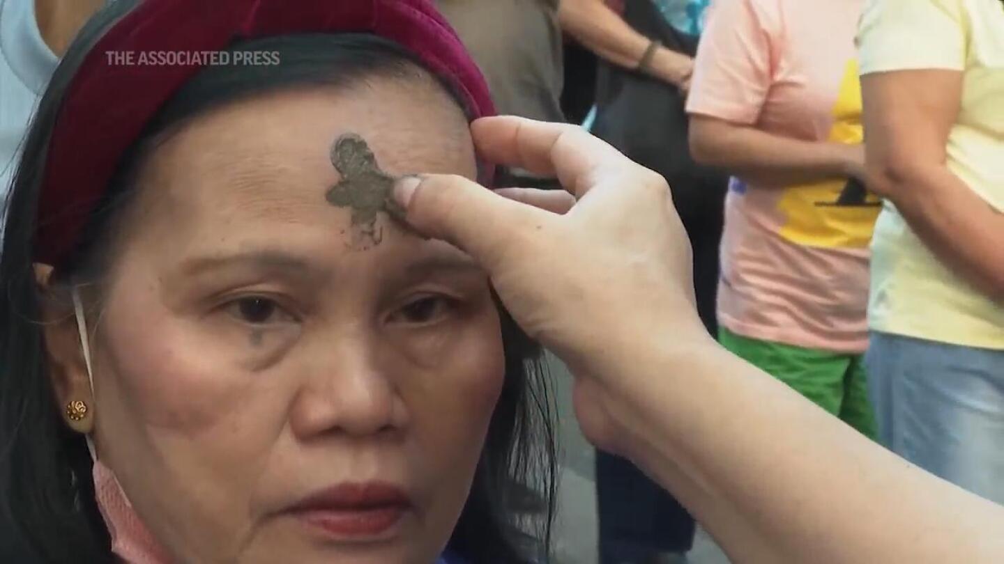 Catholics in the Philippines have their foreheads marked with ash during Ash Wednesday | AP News