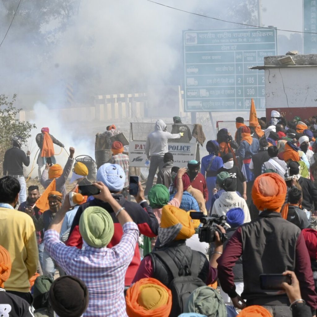 Protesting Indian farmers clash with police for a second day as they march toward the capital