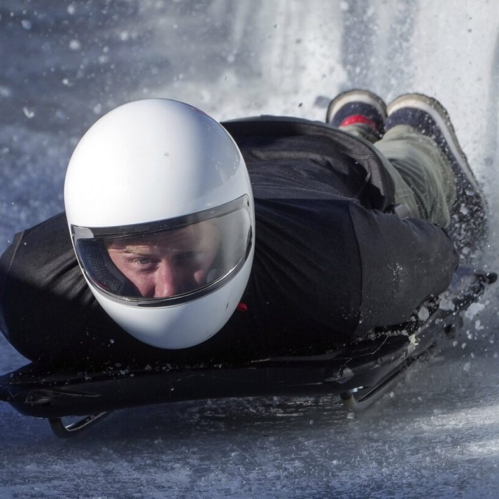 Prince Harry races head-first down a skeleton sled track and says ‘everybody should do this’