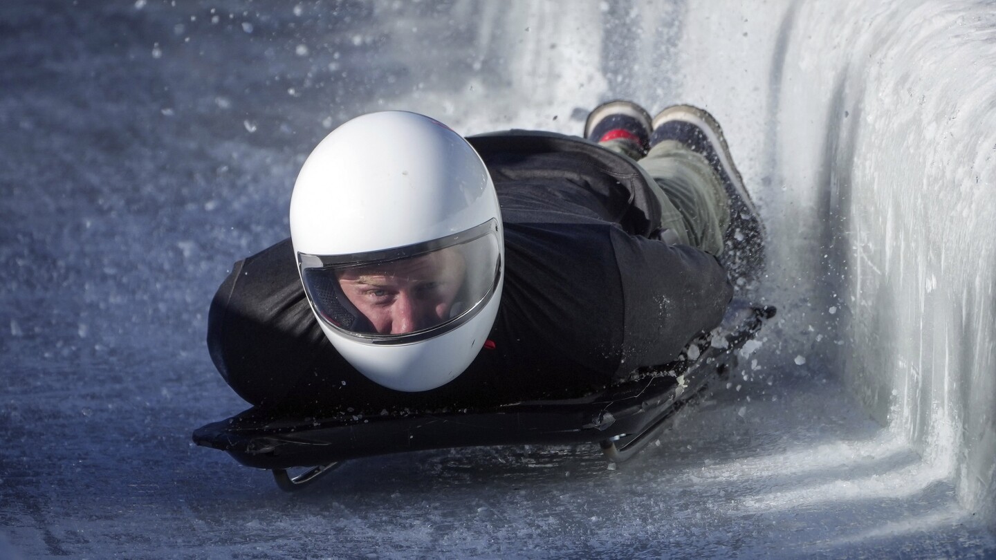 Prince Harry races head-first down a skeleton sled track and says ‘everybody should do this’