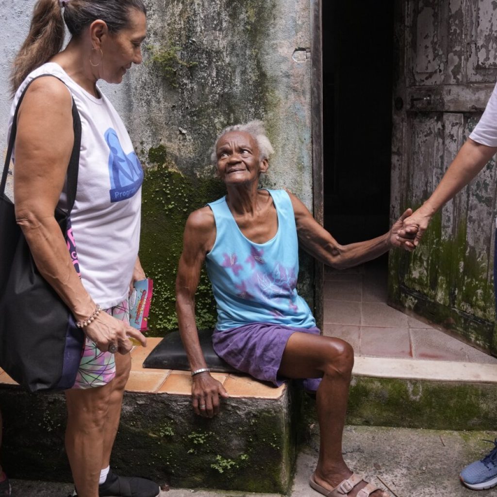 To fight dengue epidemic, health agents in Brazil scour junkyards and roofs for mosquitos