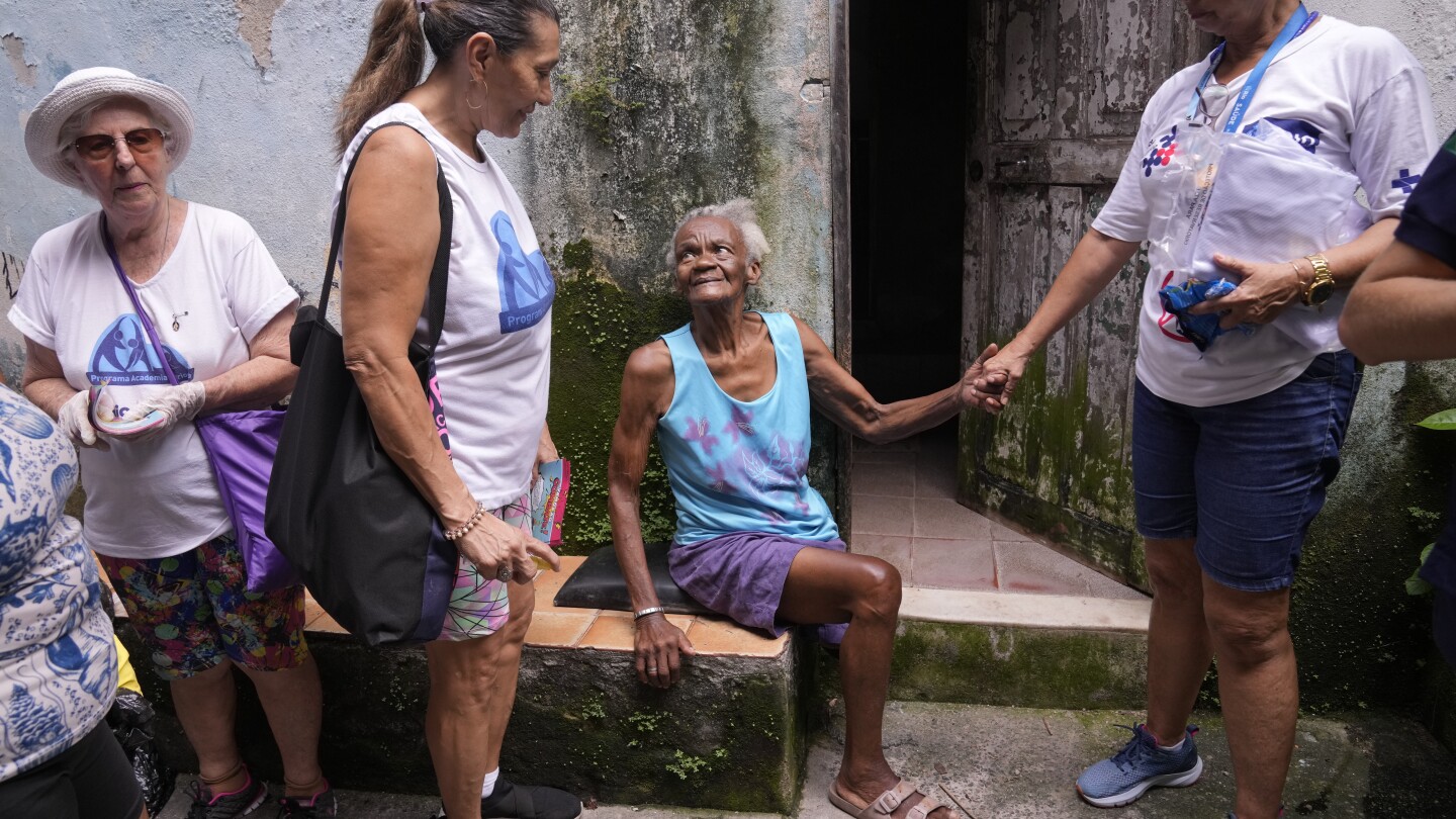 To fight dengue epidemic, health agents in Brazil scour junkyards and roofs for mosquitos