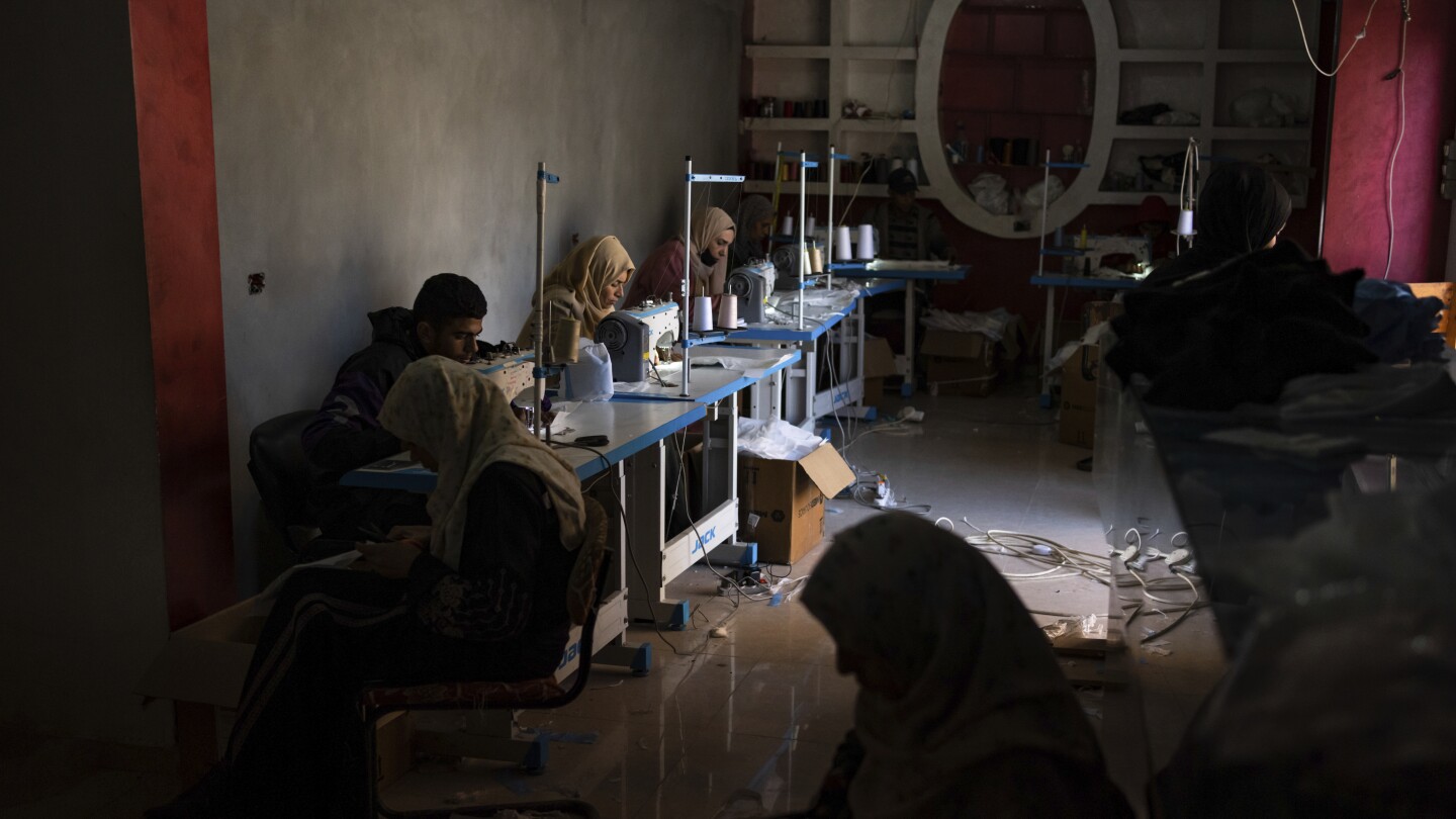 A small business in war-time Gaza sews padded cloth diapers, creating jobs and helping weary parents