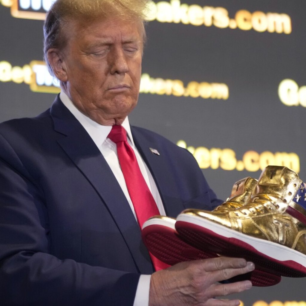 Trump hawks $399 branded shoes at ‘Sneaker Con,’ a day after a $355 million ruling against him