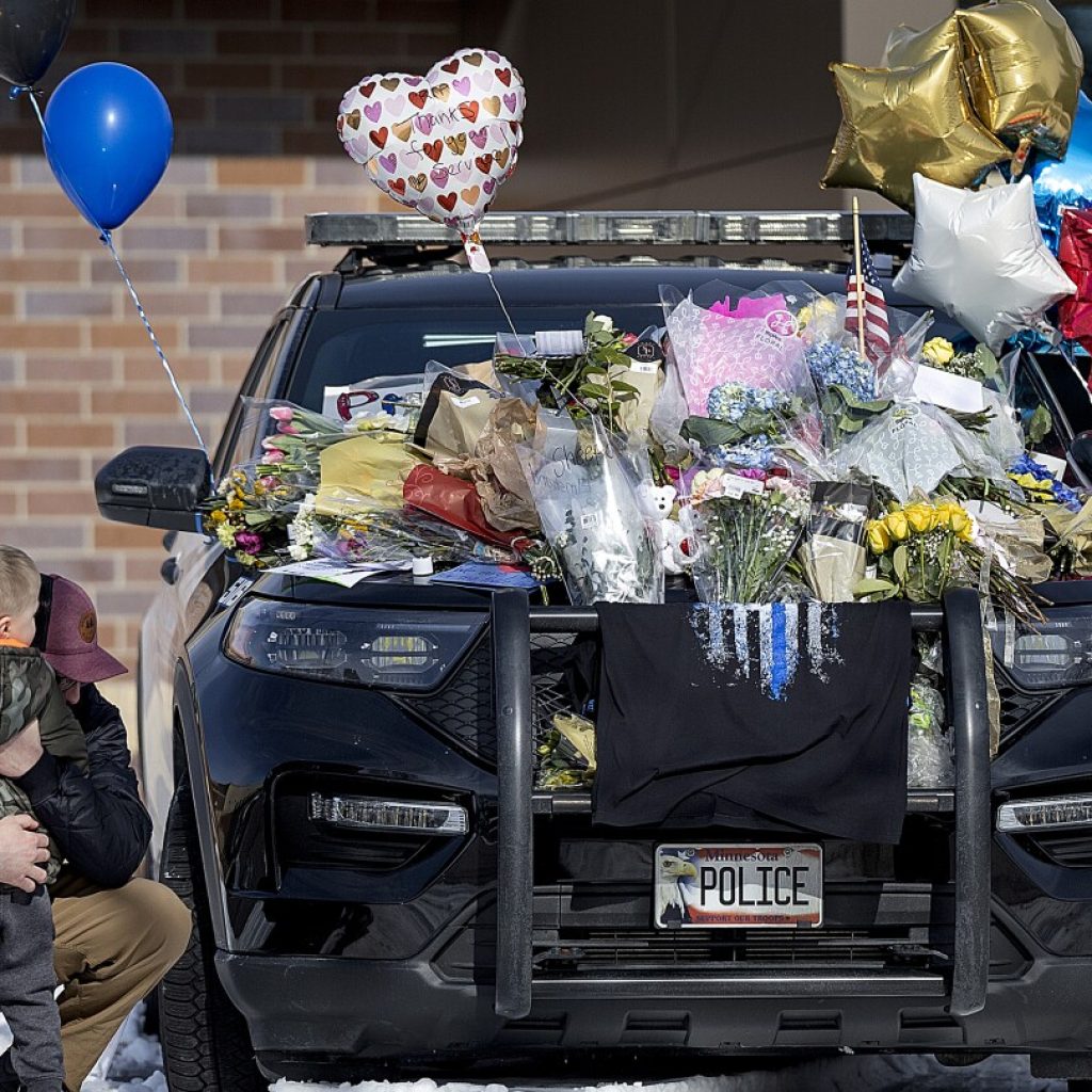 A shaken Minnesota community gets some answers on the killings of 2 officers and 1 firefighter