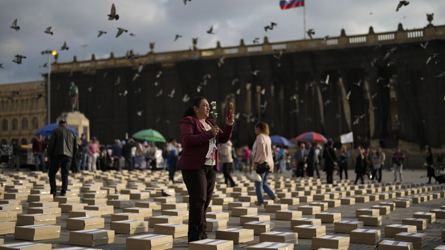 Colombians mourn the killings of hundreds of former rebel fighters and human rights leaders