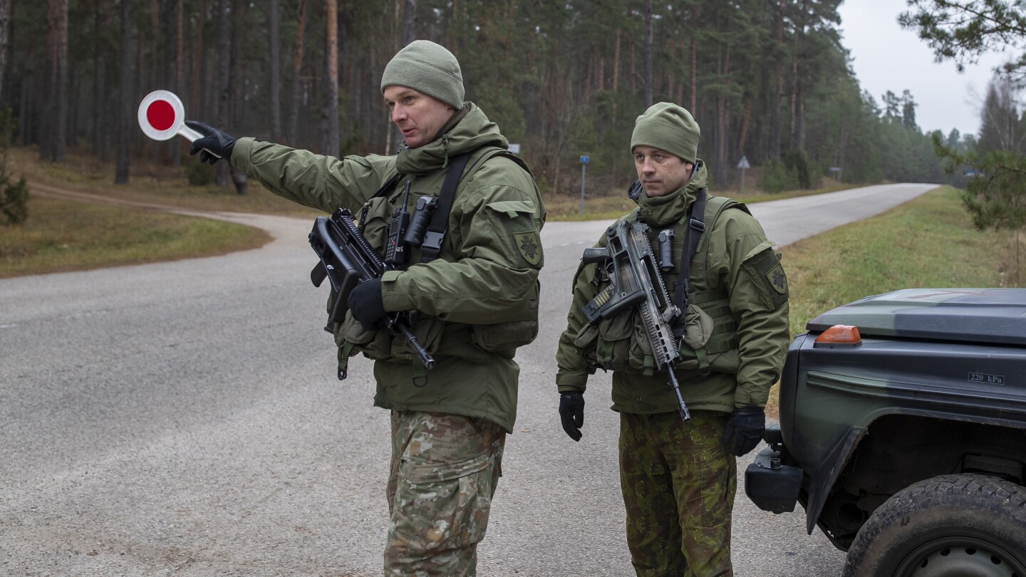 Lithuania to close 2 more checkpoints with Russian ally Belarus as tensions along the border rise