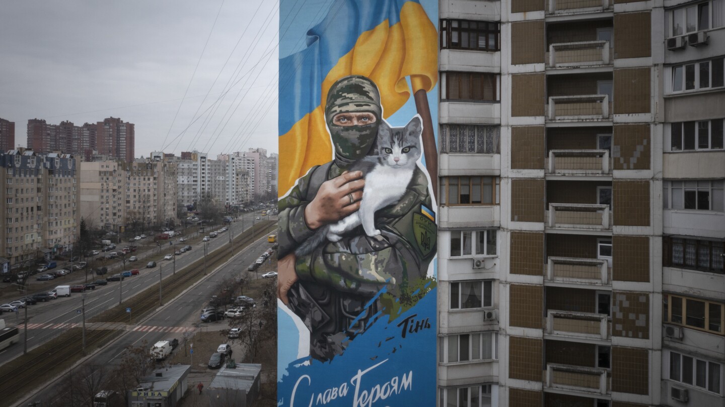 AP PHOTOS: War-themed murals in Kyiv honor Ukraine’s fallen soldiers