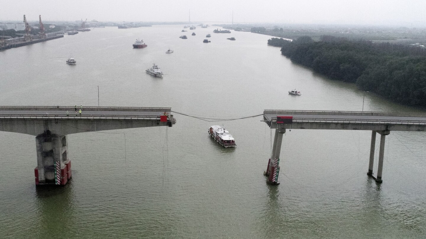 Container ship hits bridge in south China, killing 2 and knocking section of roadway into the water