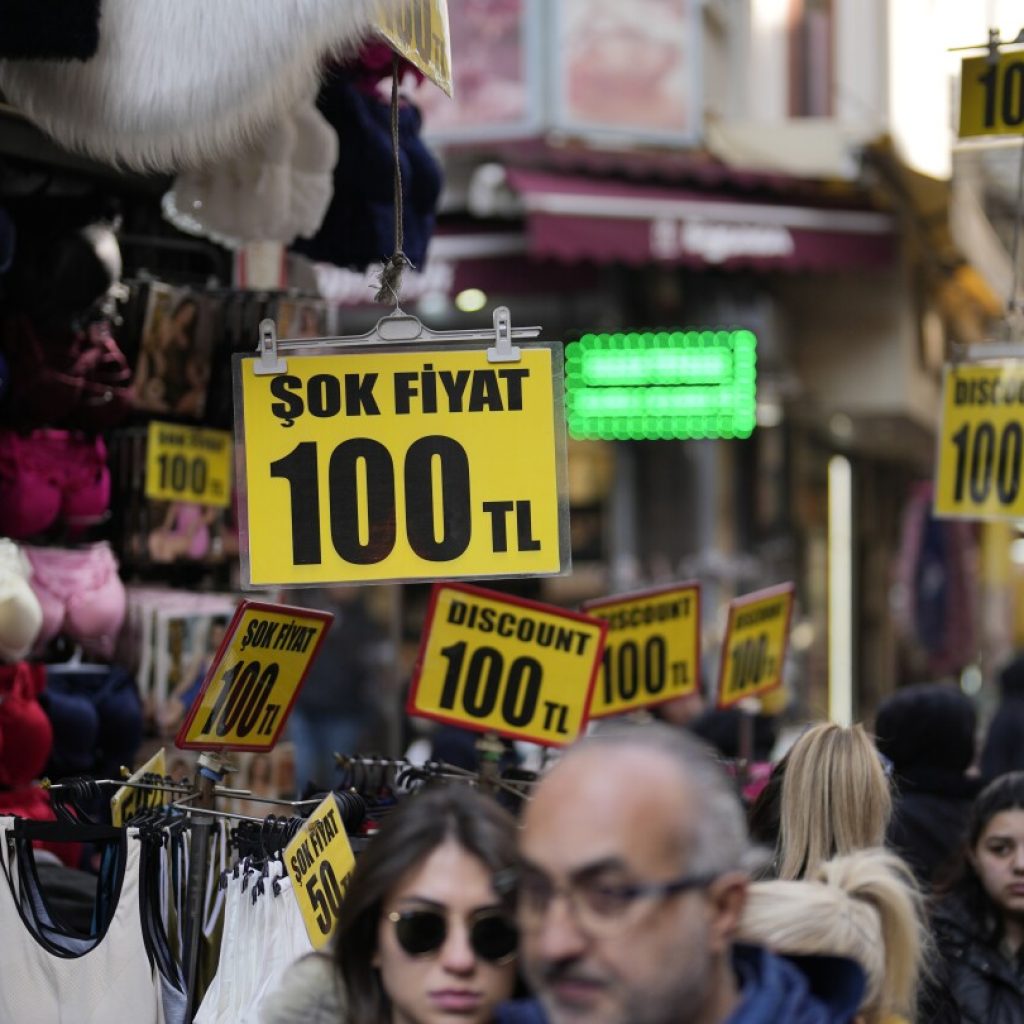 Turkish central bank keeps its key interest rate unchanged, pausing a series of hikes