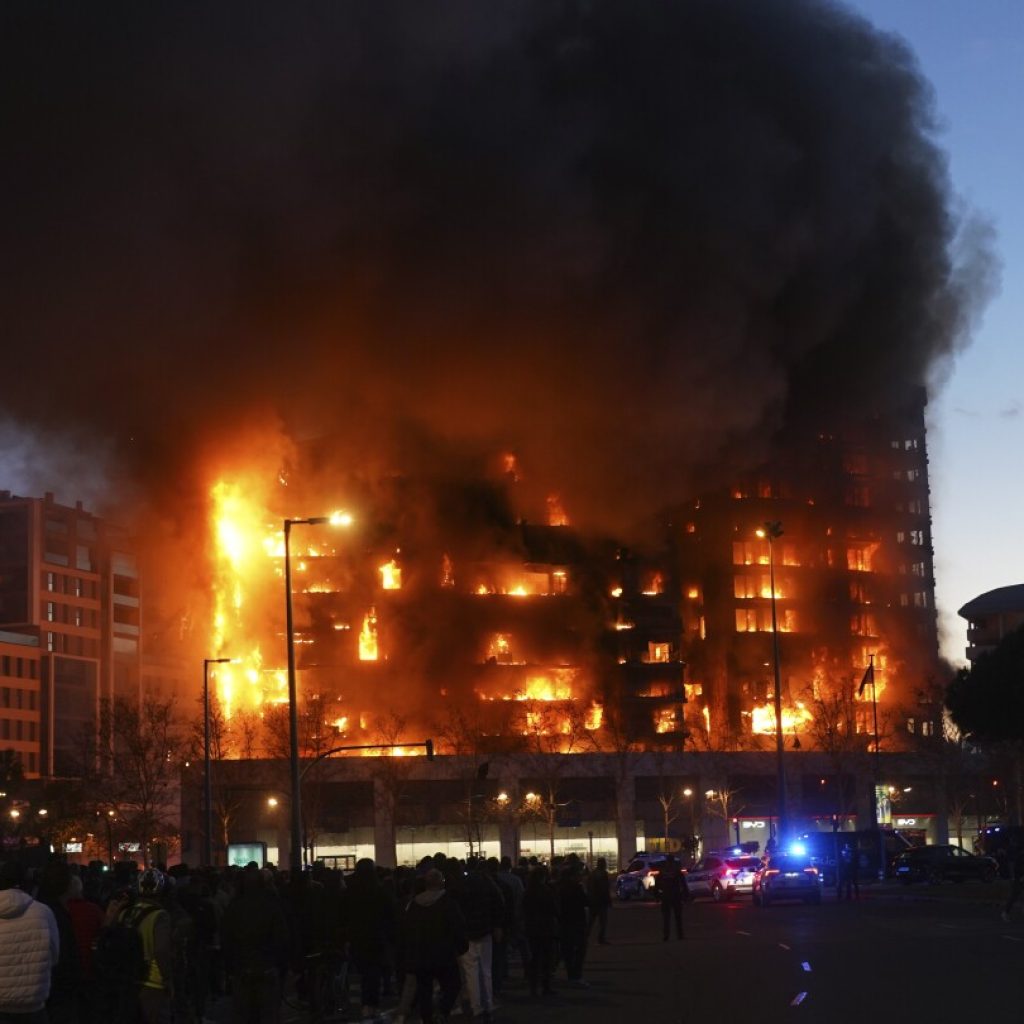 Fire engulfs 2 buildings in Spanish city of Valencia, injuring at least 13 people