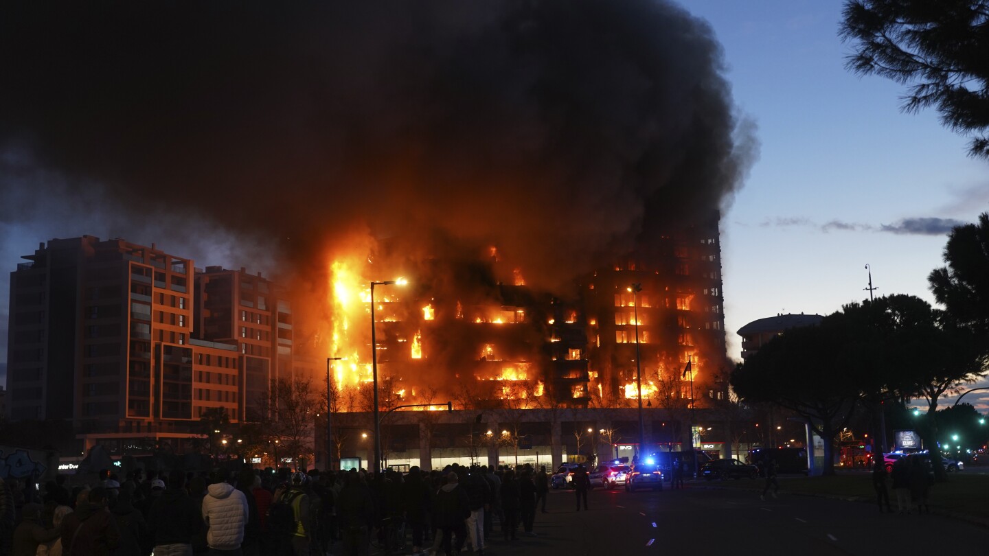 Fire engulfs 2 buildings in Spanish city of Valencia, injuring at least 13 people