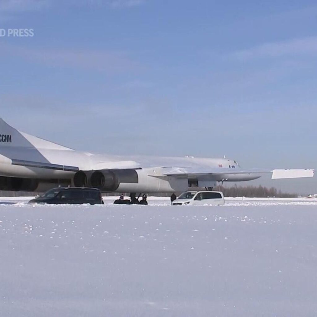 Putin shows muscle with Russia’s new military bomber | AP News