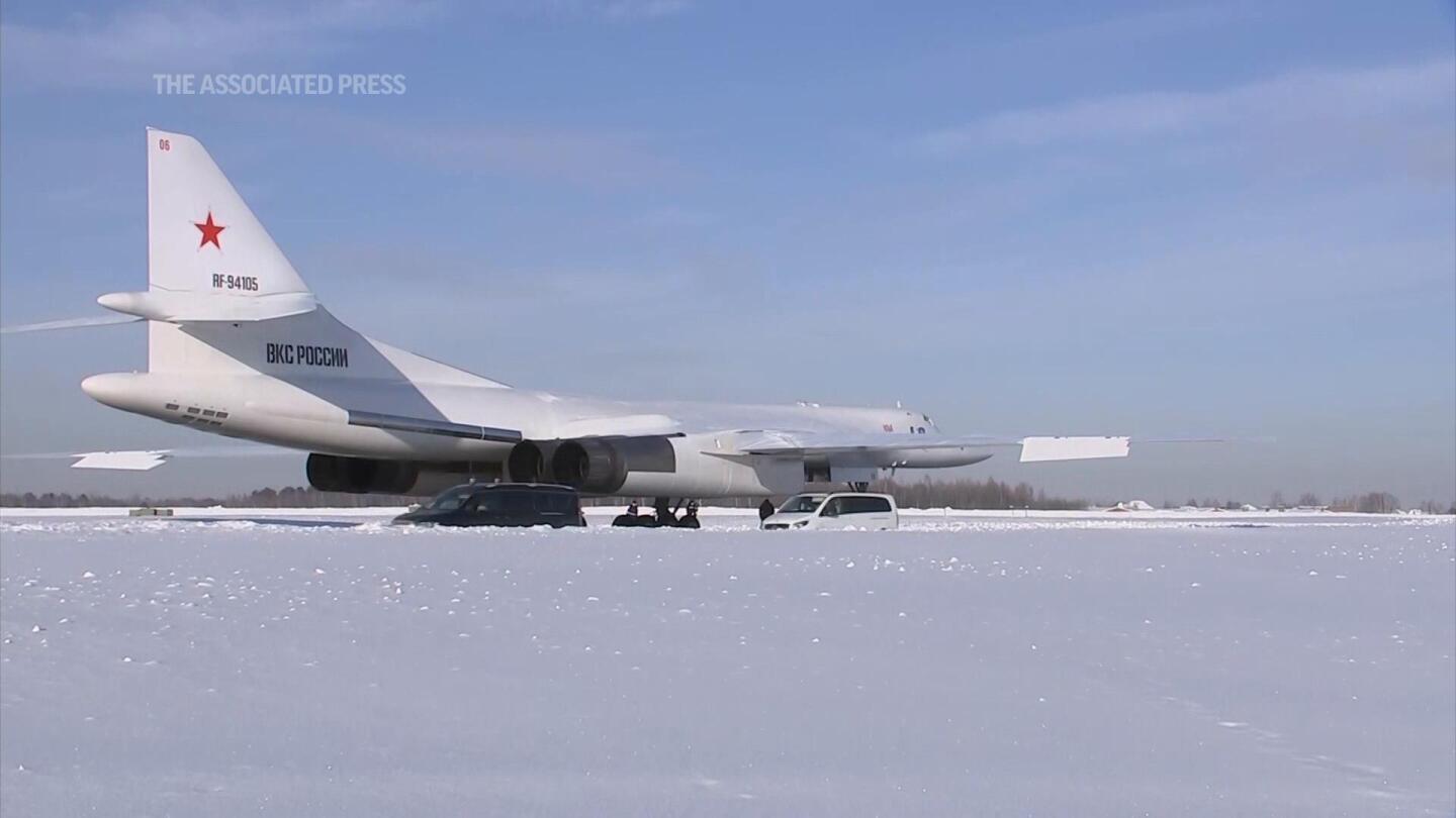 Putin shows muscle with Russia’s new military bomber | AP News