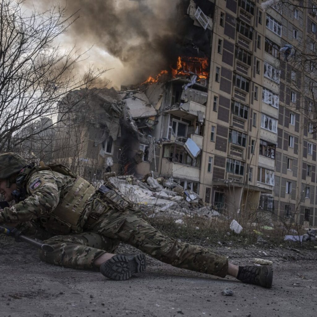 AP PHOTOS: Ukraine endures a second year of war with scenes of grief, suffering and also joy