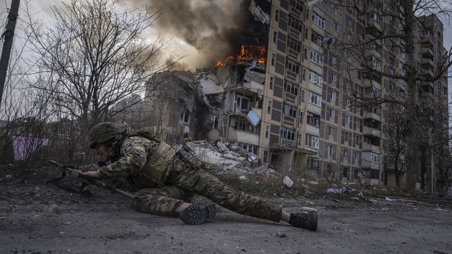 AP PHOTOS: Ukraine endures a second year of war with scenes of grief, suffering and also joy