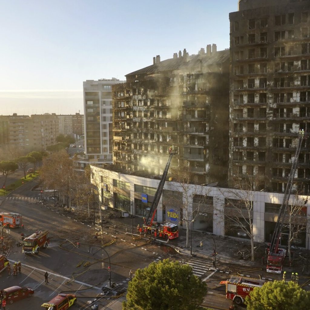 Forensic police find a 10th body in the charred remnants of a Spanish apartment building