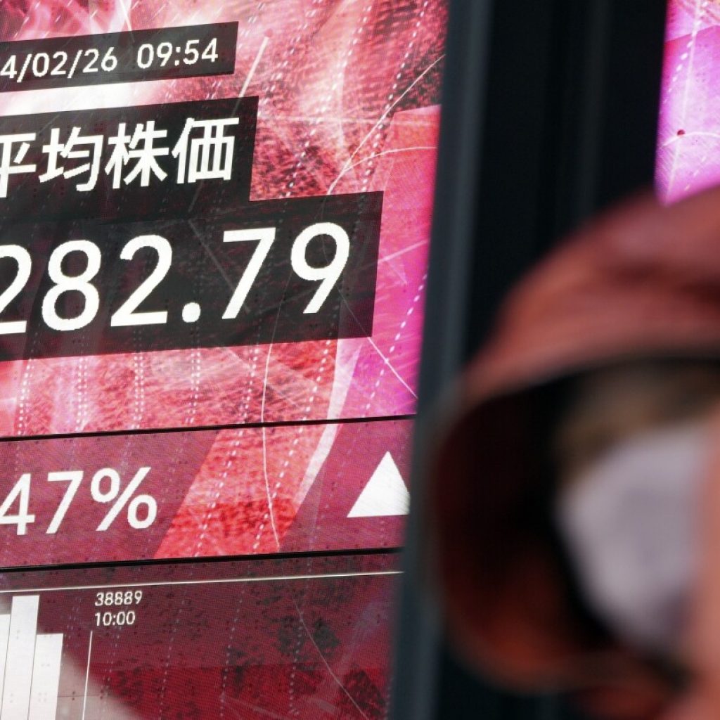 Stock market today: Asian shares mostly decline, while Tokyo again touches a record high