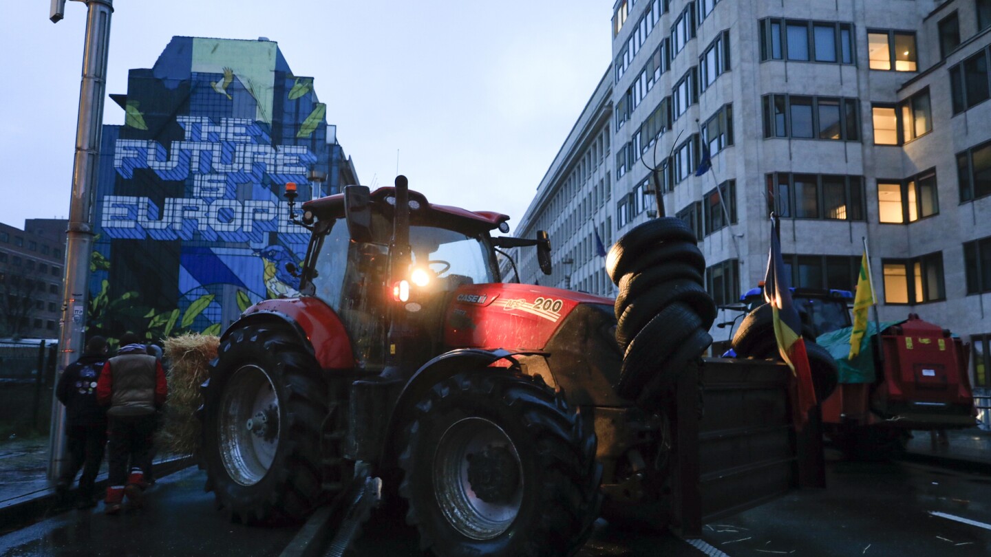 Farmers converge on the European Union’s headquarters in a fresh show of force