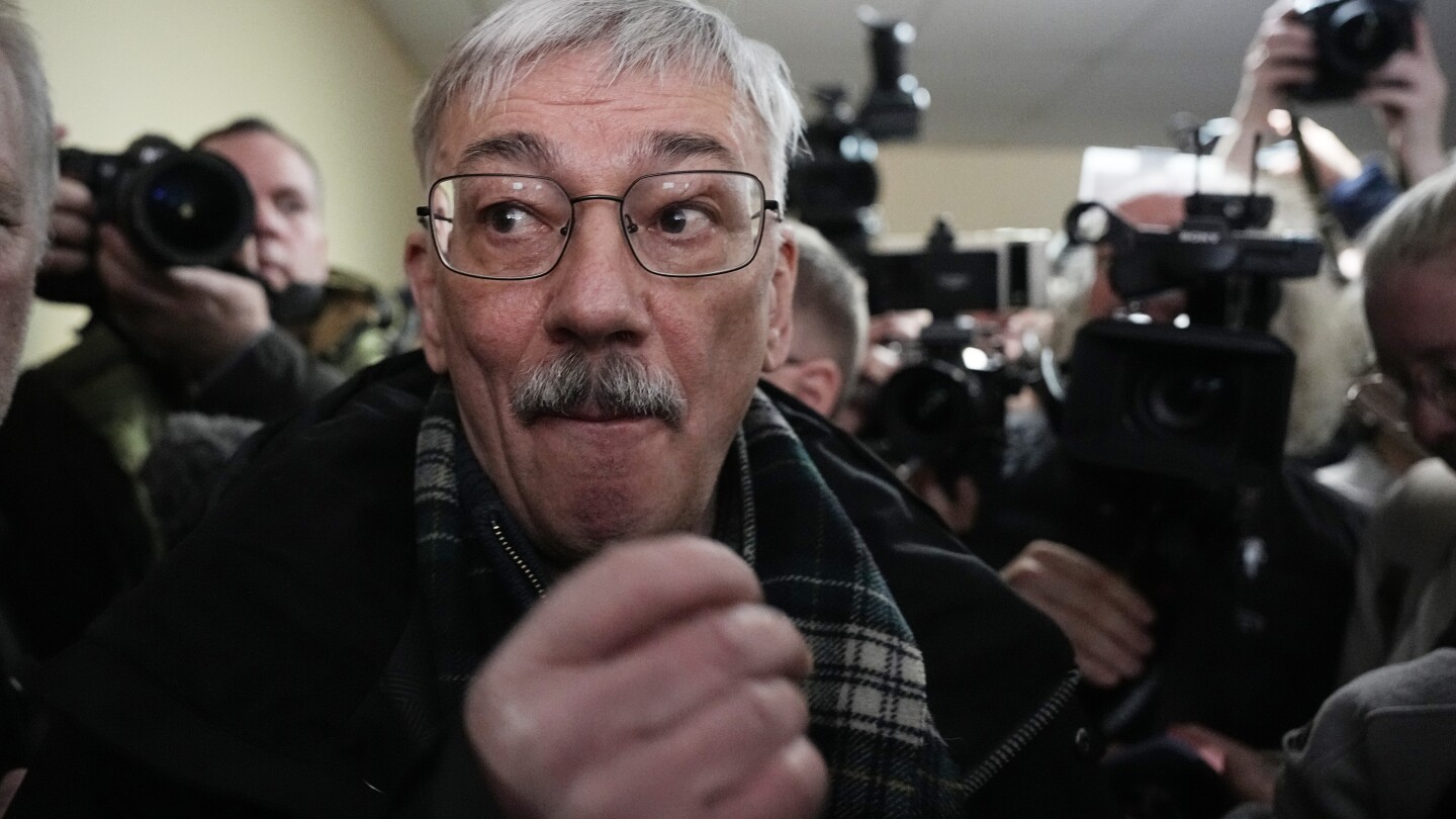 The co-chair of a Nobel-winning rights group in Russia gets 30 months in jail for criticizing war