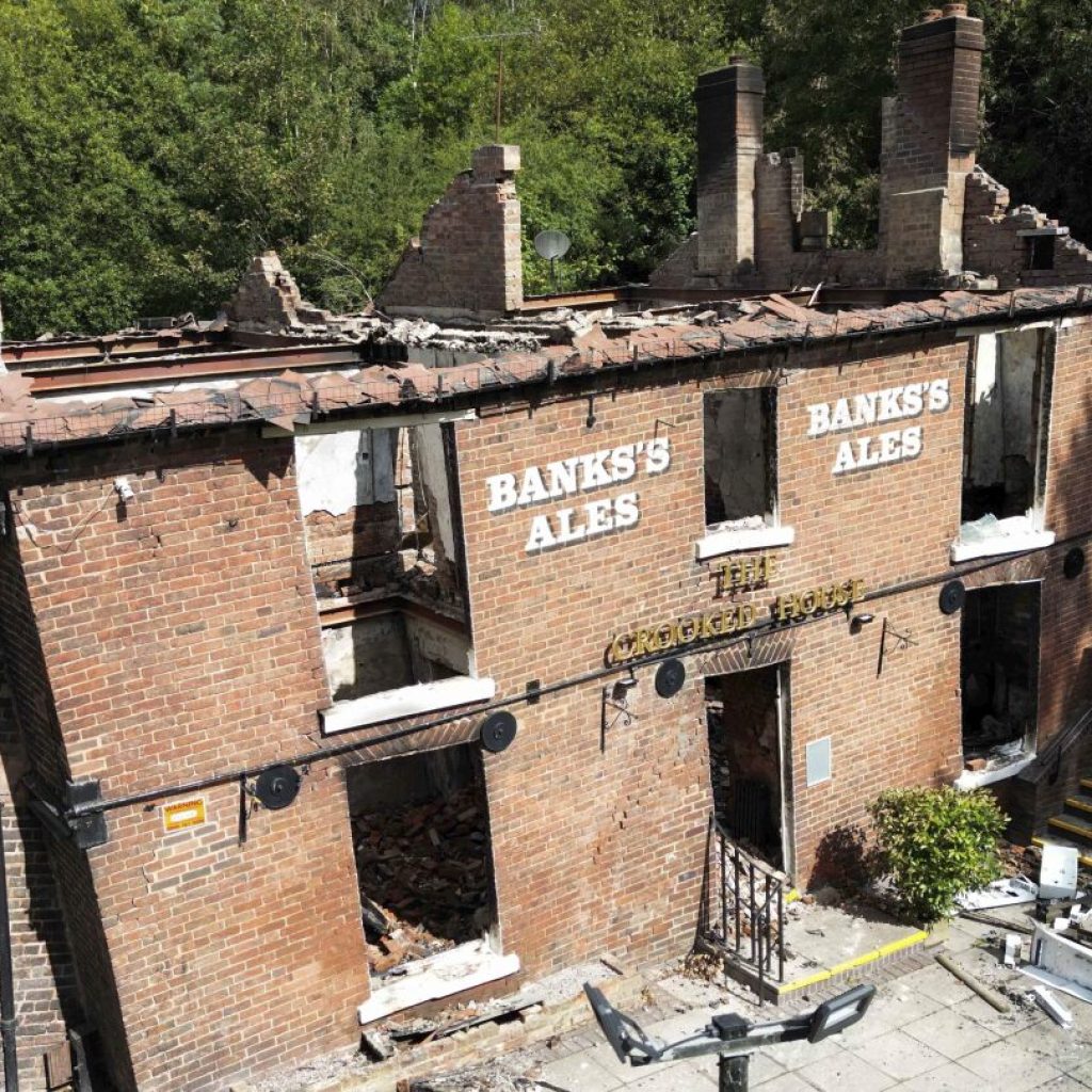 Cheers to being crooked again. Quirky English pub bulldozed after a fire to be rebuilt as it was