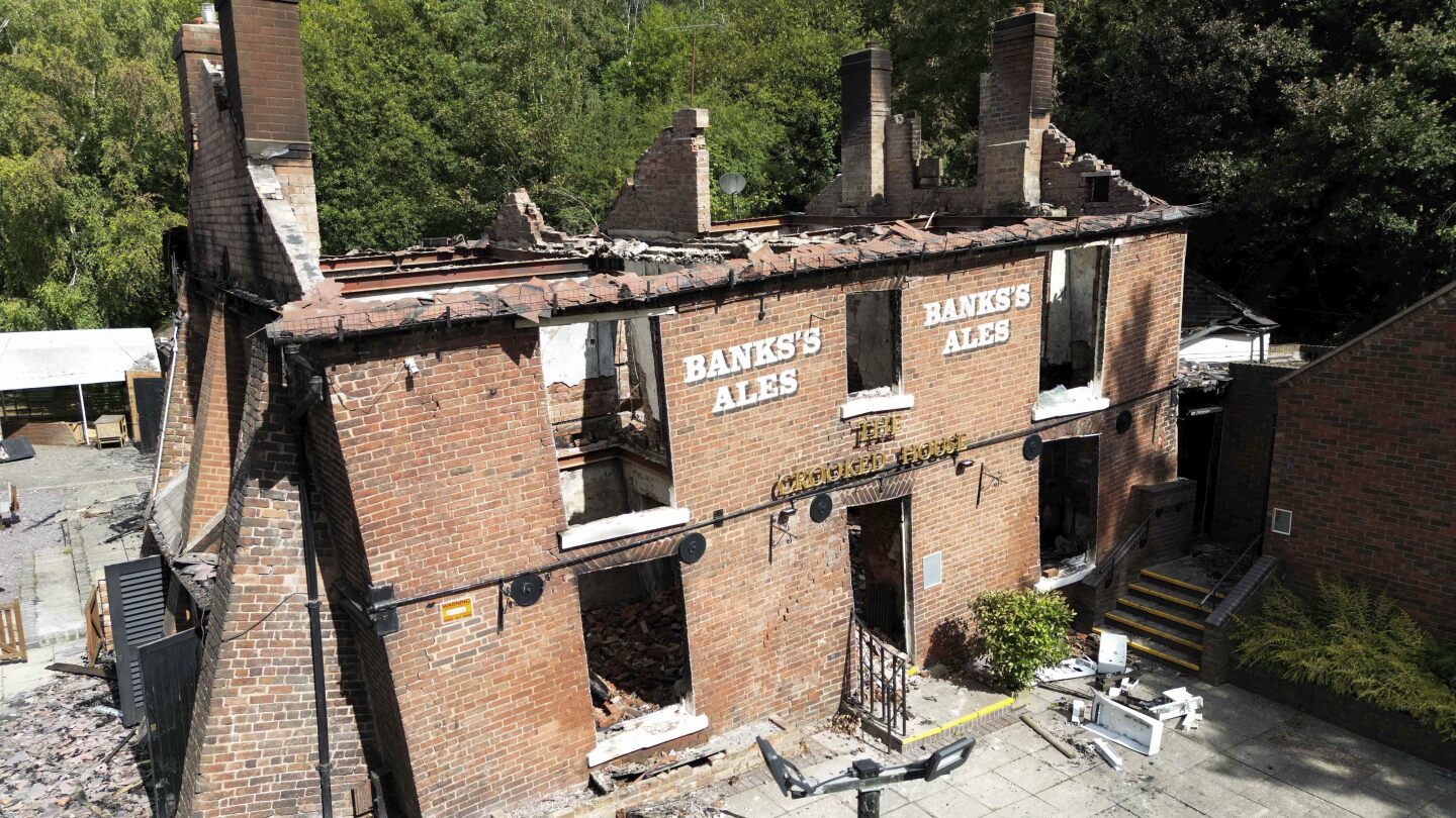 Cheers to being crooked again. Quirky English pub bulldozed after a fire to be rebuilt as it was